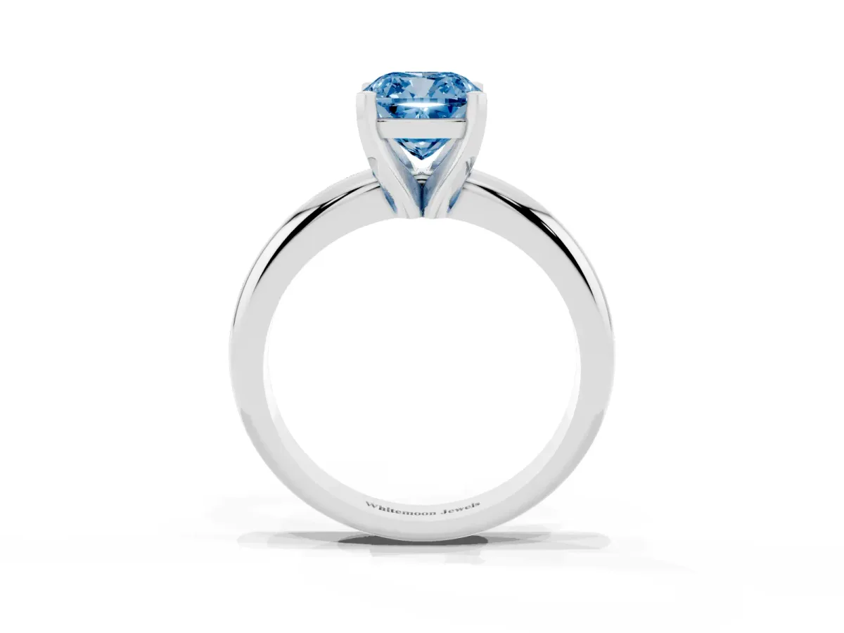 Fancy Blue Cushion Cut Diamond Solitaire Engagement Ring with Round Band and Four-Prong Setting Platinum