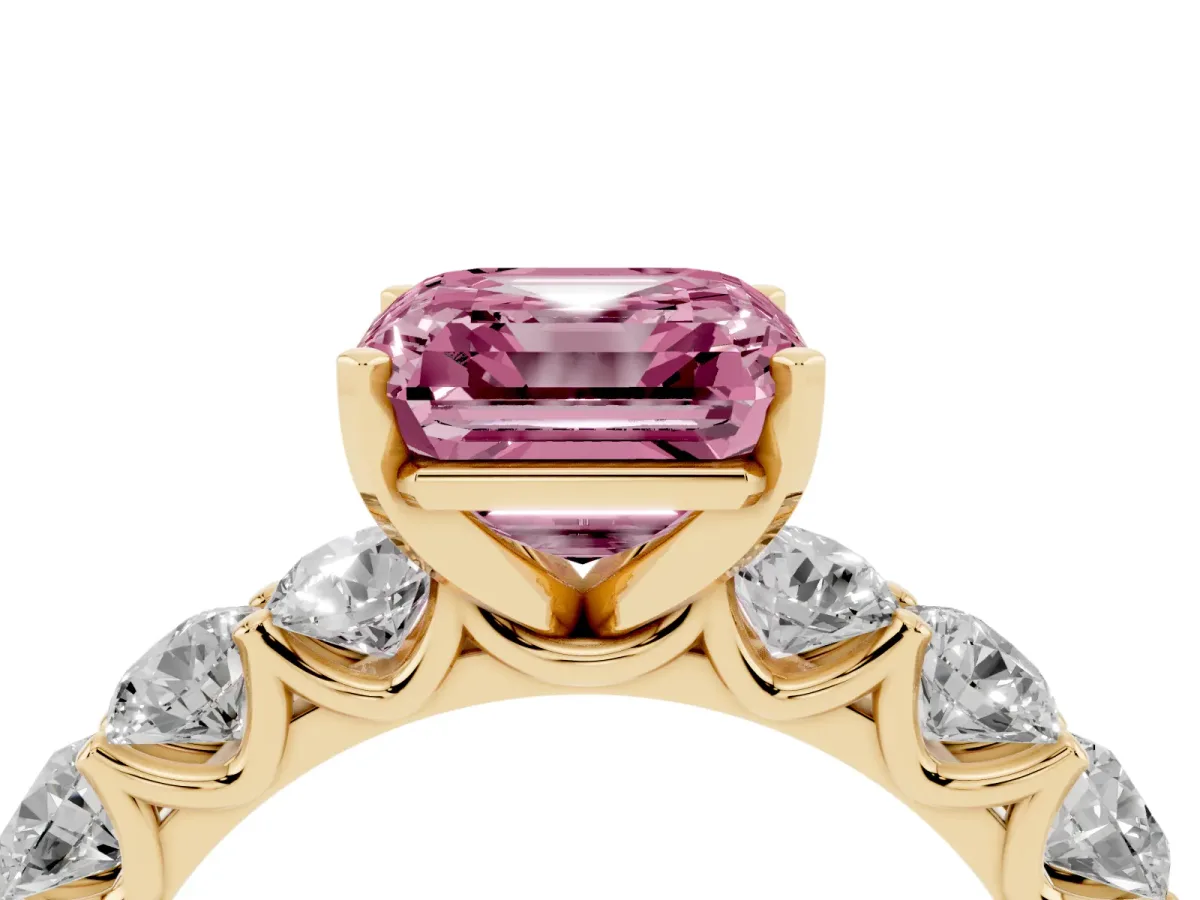 Fancy Pink Asscher Cut Diamond Prong Setting with Side Stones on a Pave Band Yellow gold