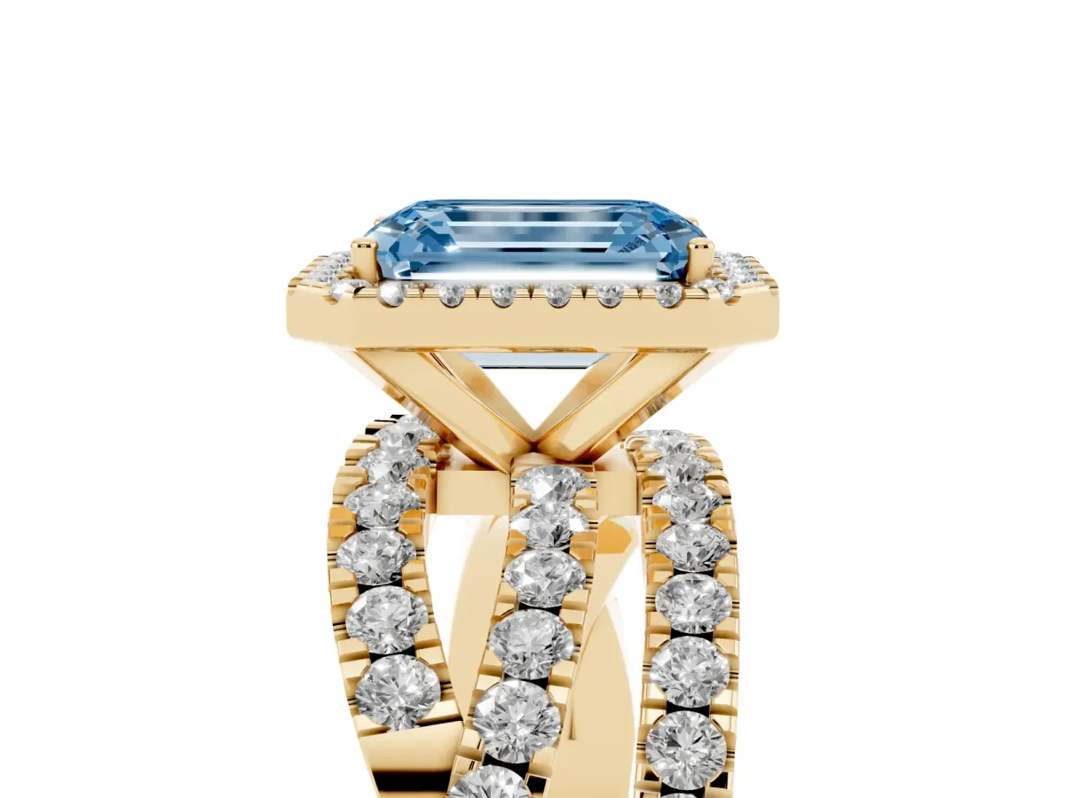 Fancy Blue Emerald Cut Diamond Halo Ring with Round Split Shank and Prong Setting Yellow gold