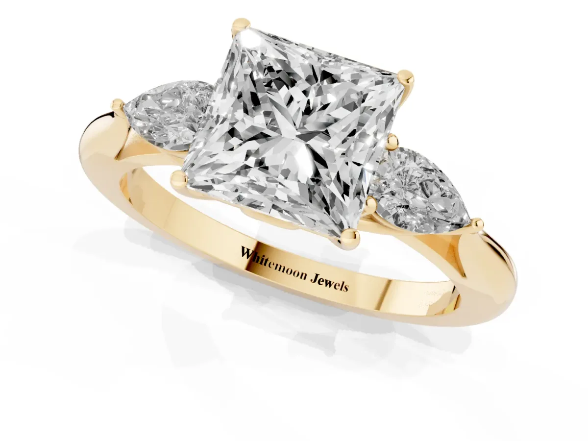 Three-Stone Princess Cut Diamond Ring with Pear Side Stones in Four-Prong Setting Yellow gold