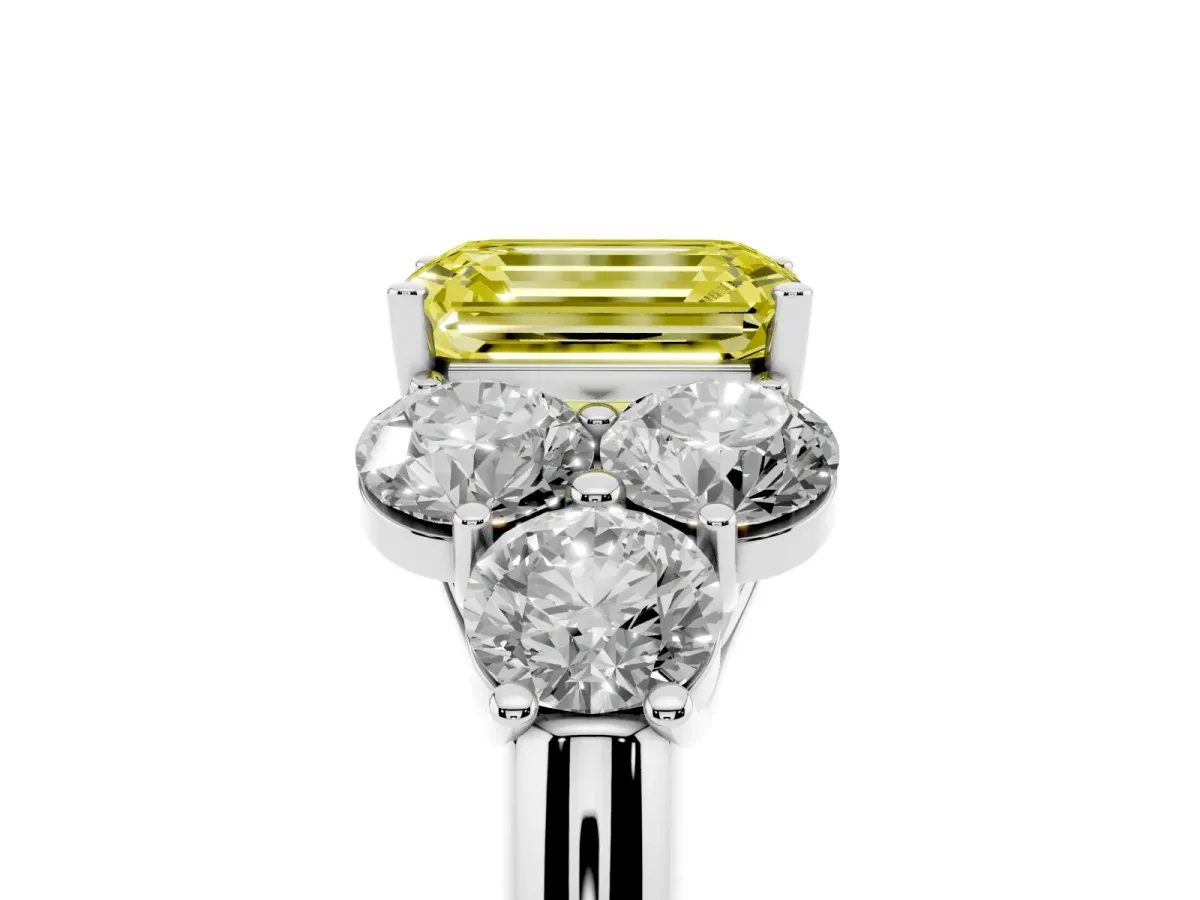 Fancy Yellow Emerald Cut Cut Diamond Cluster Ring with Round Accent Stones and Prong Setting on a Classic Band Silver