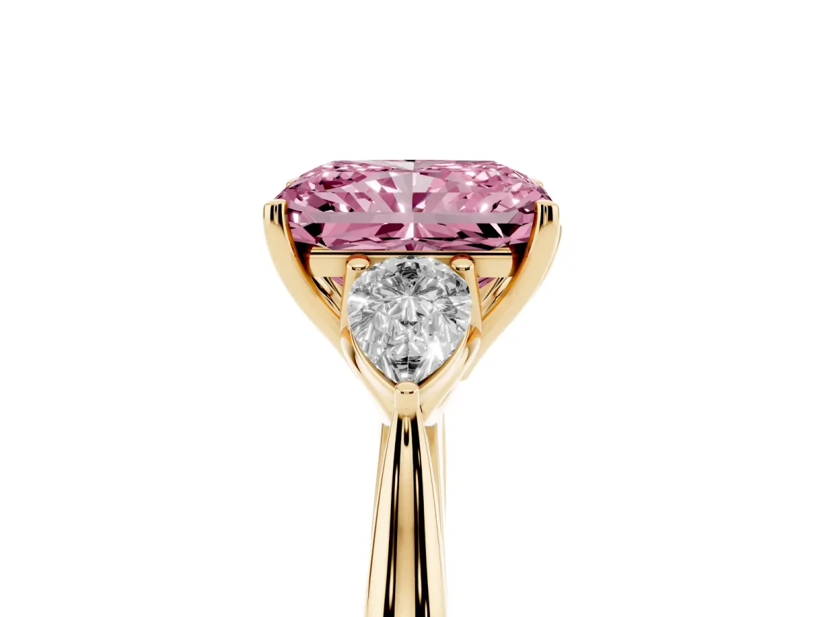 Fancy Pink Three-Stone Radiant Cut Brilliant Diamond Solitaire Ring with Tapered Band and Four-Prong Setting Yellow gold