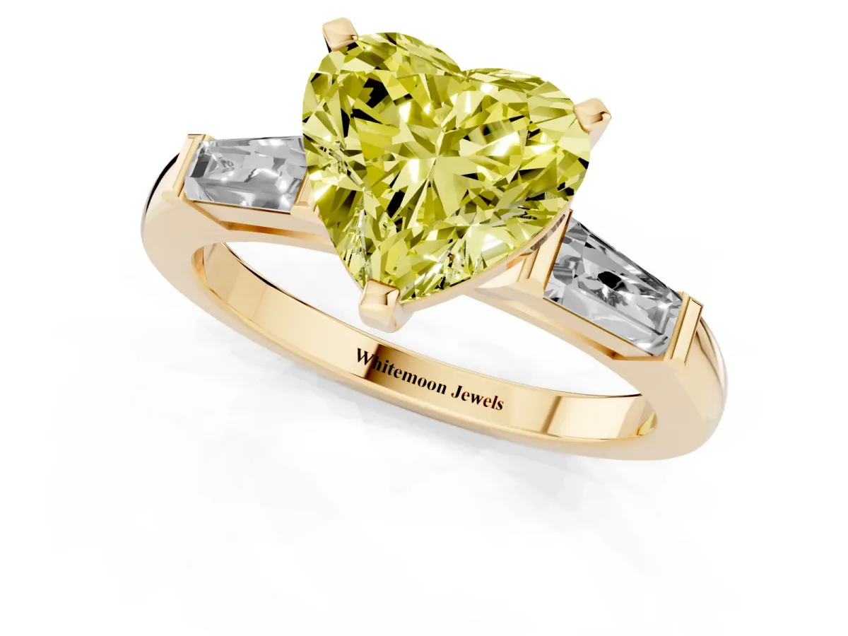 Fancy Yellow Heart Cut Solitaire with Tapered Baguette Side Stones on a Classic Band with Four-Prong Setting Yellow gold