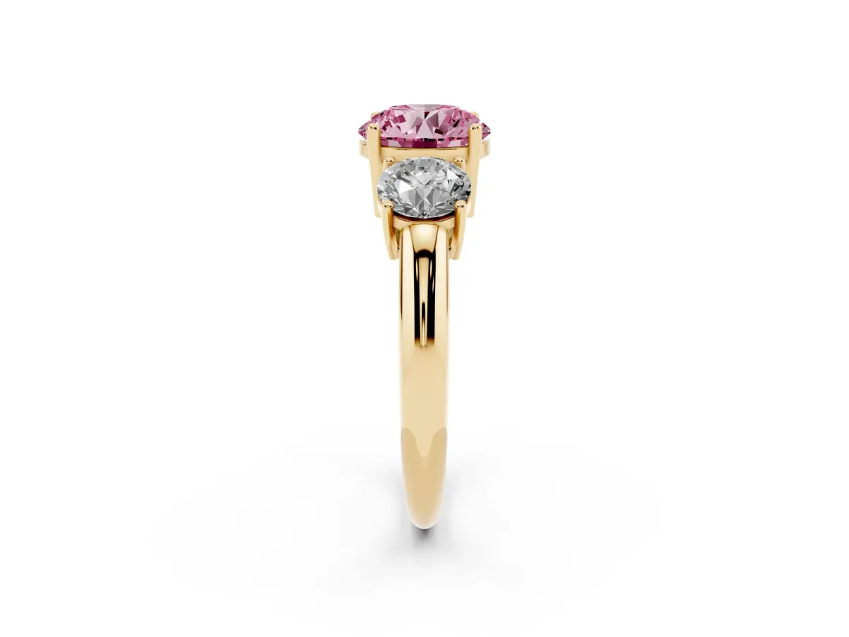 Fancy Pink Three-Stone Round Cut Cut Diamond Engagement Ring with Prong Setting on a White Gold Band Yellow gold