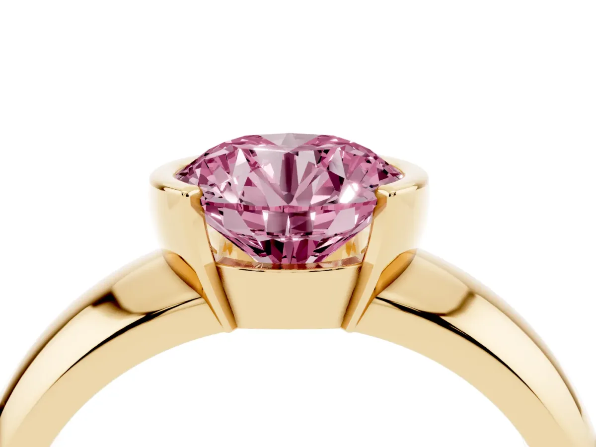 Fancy Pink Round Cut Solitaire Tension Set Diamond Ring with Wide Band Yellow gold
