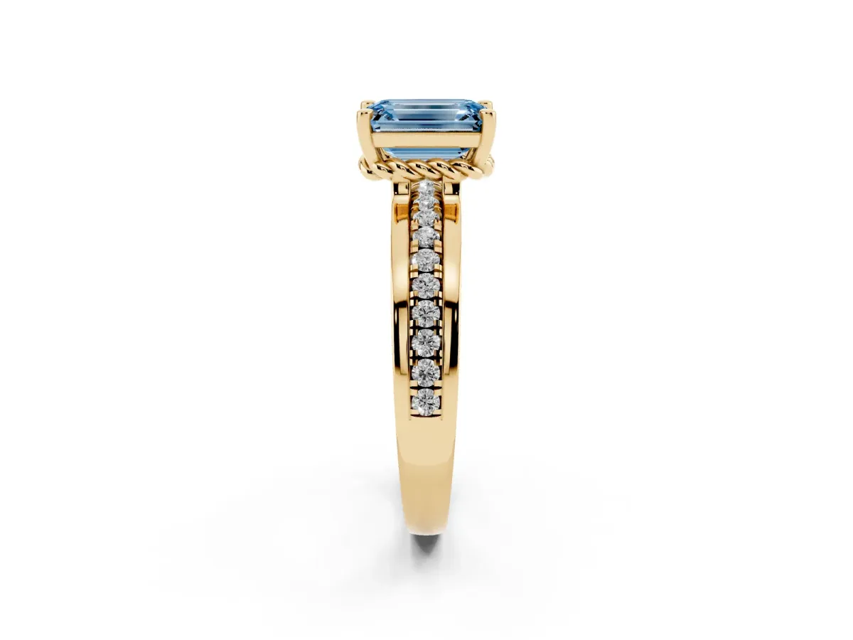 Fancy Blue Emerald Cut Solitaire Diamond Ring with Channel Set Band and Six-Prong Setting Yellow gold