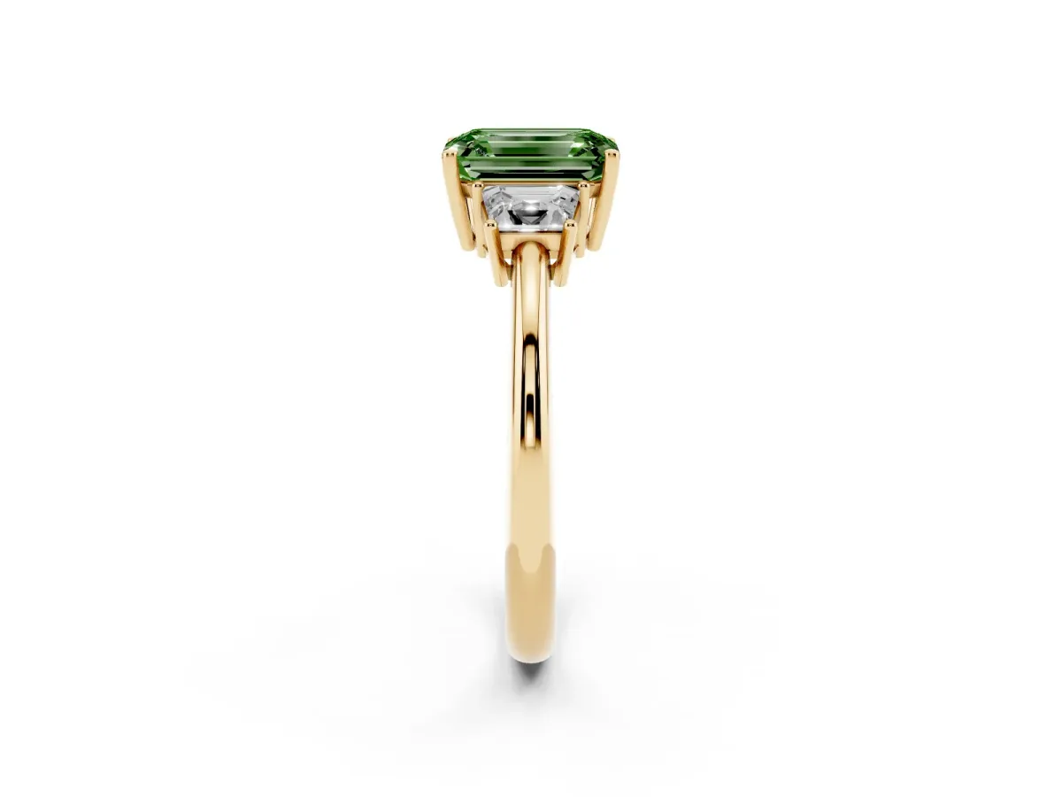 Fancy Green Emerald Cut Diamond Three-Stone Ring with Trapezoid Side Stones and Prong Setting Yellow gold