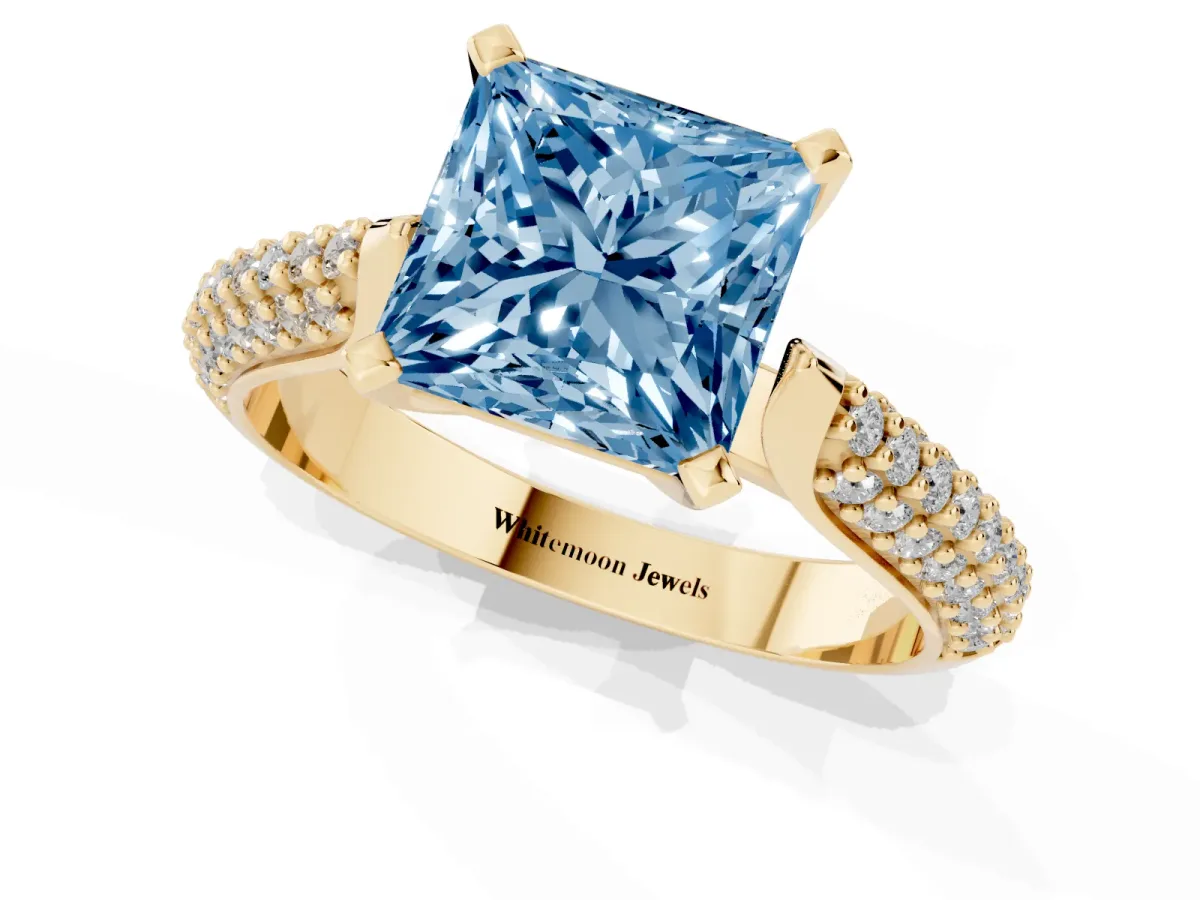 Fancy Blue Princess Cut Diamond Solitaire Engagement Ring with Multi-Row Round Pavé Band and Prong Setting Yellow gold