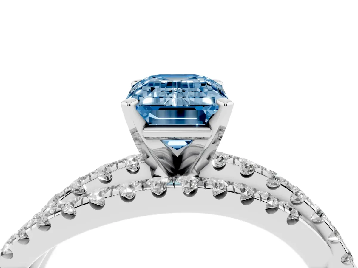 Fancy Blue Emerald Cut Solitaire Twist Band with Pavé Setting and Four-Prong Setting Silver