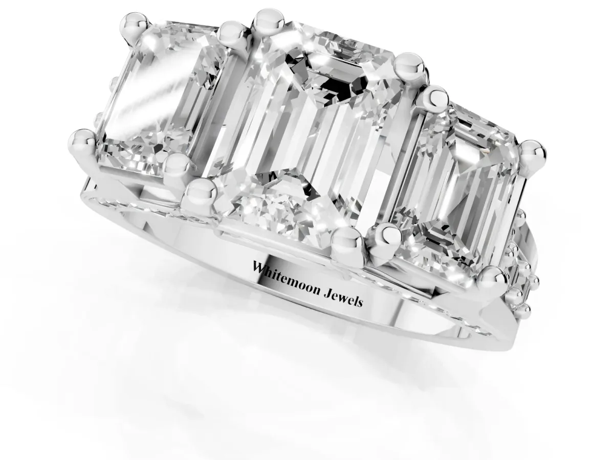 Emerald Cut Diamond Three-Stone Ring with Channel Set Band and Four-Prong Setting Silver