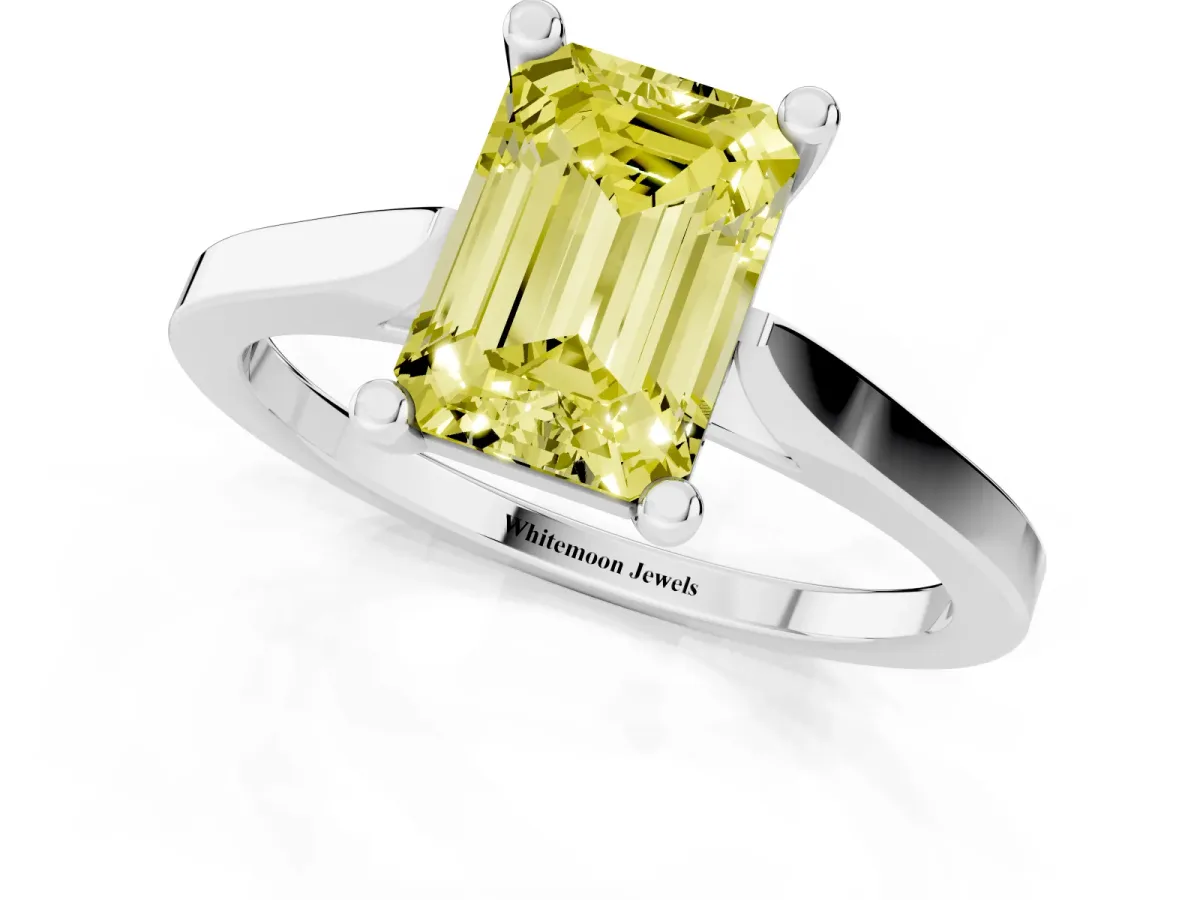 Fancy Yellow Emerald Cut Solitaire Diamond Ring with Four-Prong Setting and Tapered Band Silver
