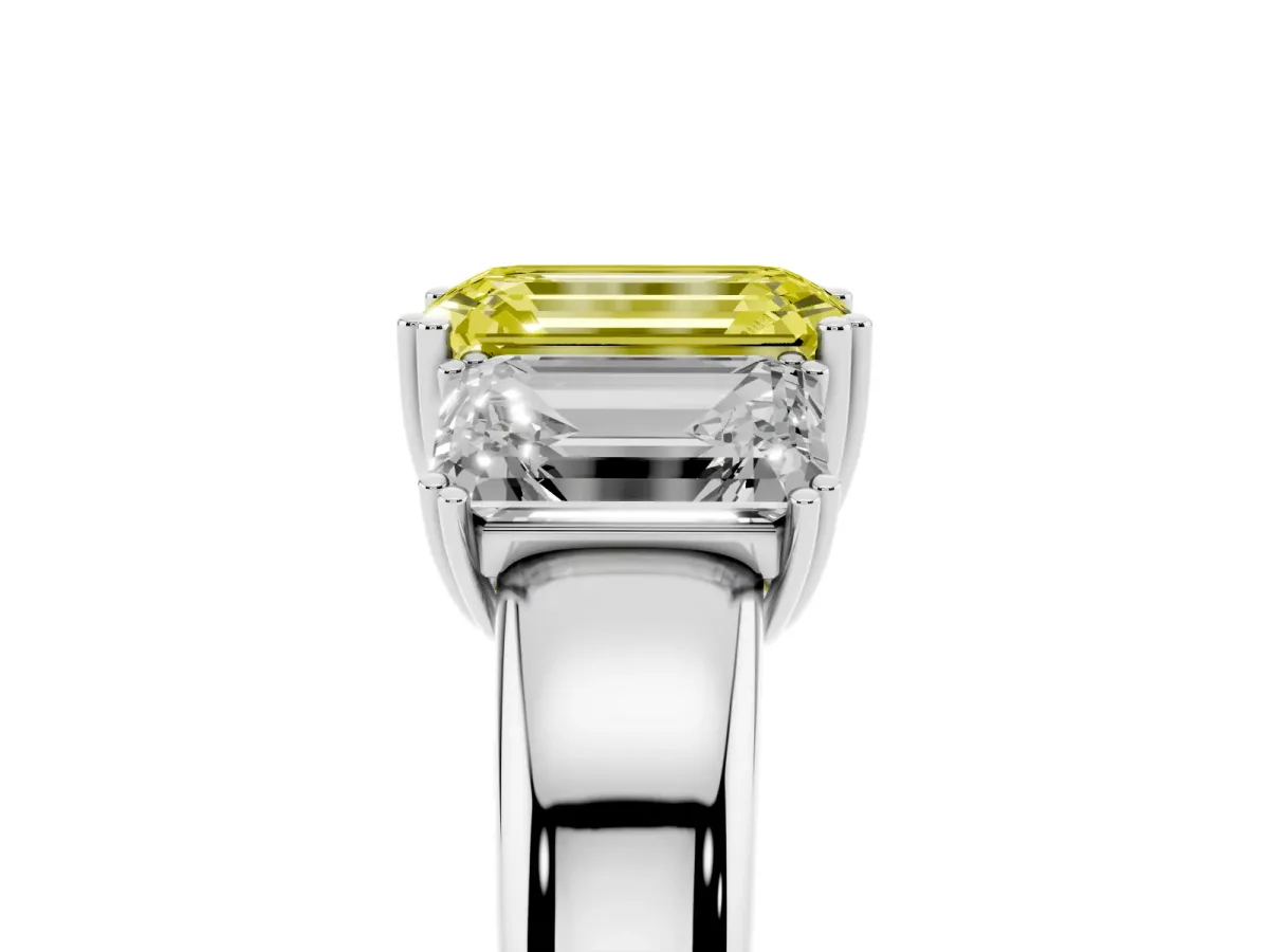 Fancy Yellow Three-Stone Emerald Cut Cut Diamond Ring with Channel Set Band and Four-Prong Setting White gold