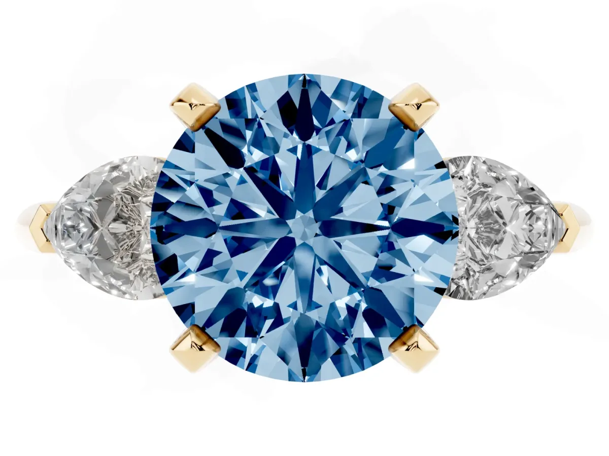 Fancy Blue Three-Stone Round Cut Diamond Ring with Pear Side Stones and Four-Prong Setting Yellow gold