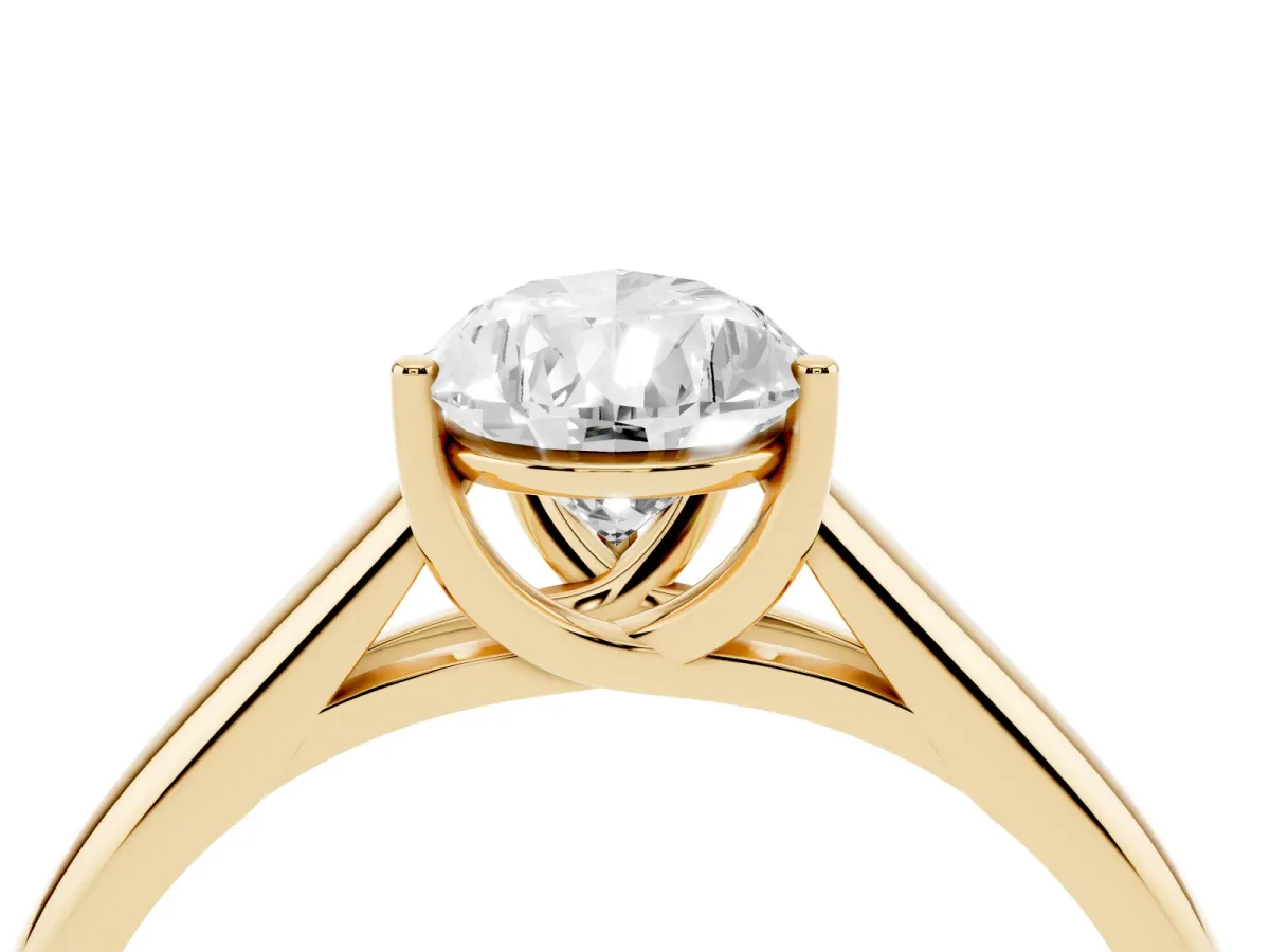 Pear Cut Solitaire Engagement Ring with Tapered Band and Four-Prong Setting Yellow gold