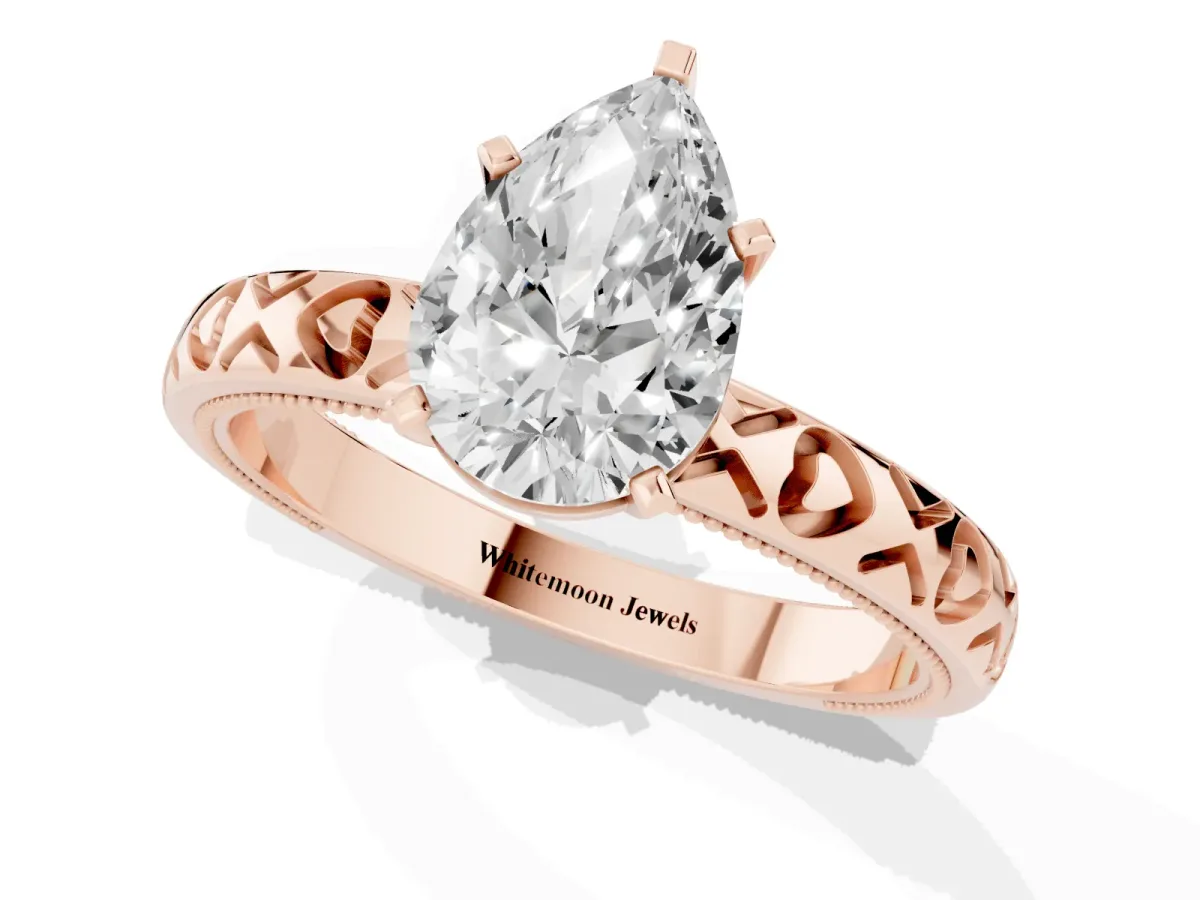 Pear Cut Solitaire Diamond Engagement Ring with XO Engraved Band and Four-Prong Setting Rose gold