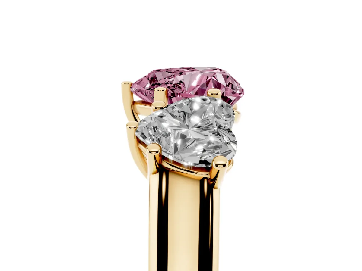 Fancy Pink Heart Cut Three-Stone Diamond Ring with Prong Setting on a Classic Band Yellow gold