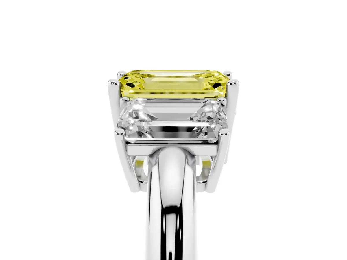 Fancy Yellow Three-Stone Emerald Cut Cut Diamond Engagement Ring with Prong Setting on a White Gold Band Platinum
