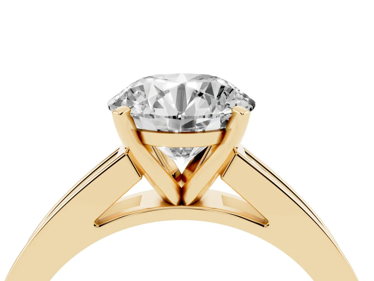 Round Cut Solitaire Diamond Ring with Channel-Set Band and Four-Prong Setting Yellow gold
