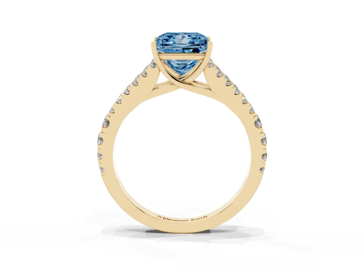 Fancy Blue Princess Cut Diamond Split Shank Engagement Ring with Round Pavé and Prong Setting Yellow gold