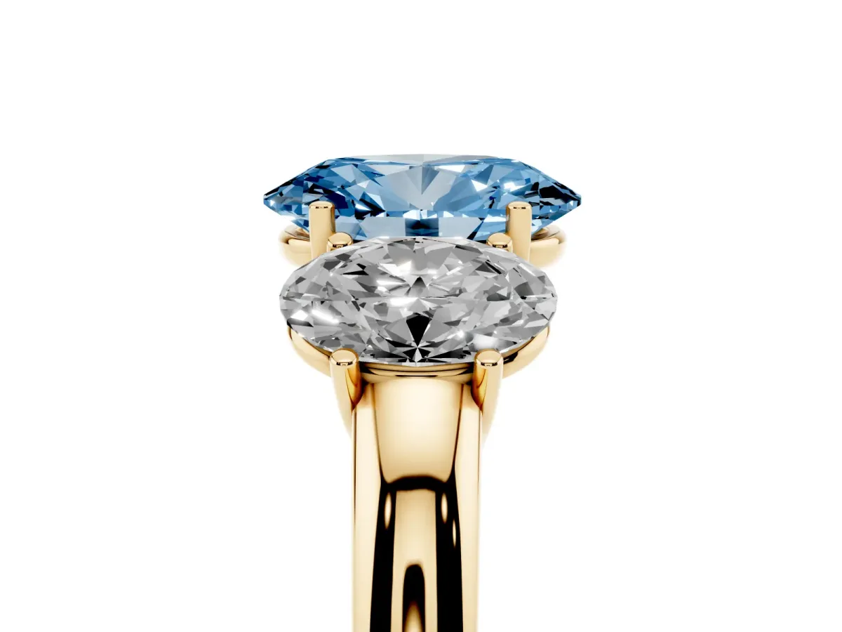 Fancy Blue Oval Cut Diamond Three-Stone Ring with Four-Prong Setting and Classic Band Yellow gold