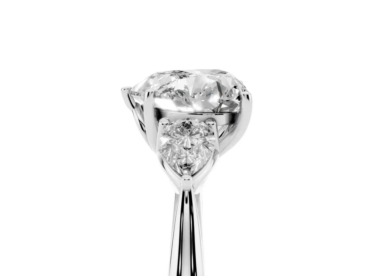 Three-Stone Heart Cut Diamond Ring with Pear Side Stones in Four-Prong Setting Silver