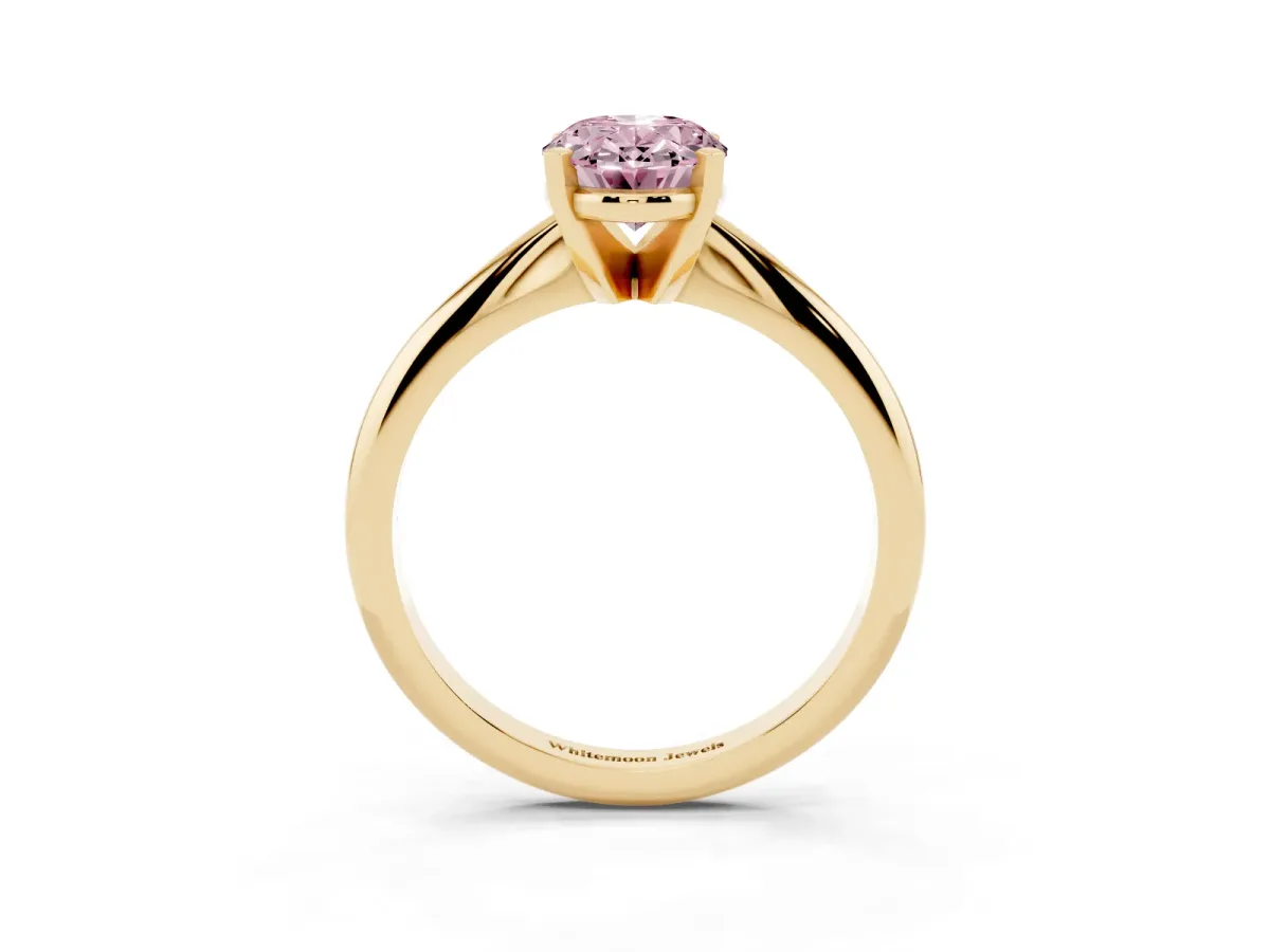 Fancy Pink Oval Cut Cut Solitaire Ring with Four-Prong Setting on a Classic Band Yellow gold