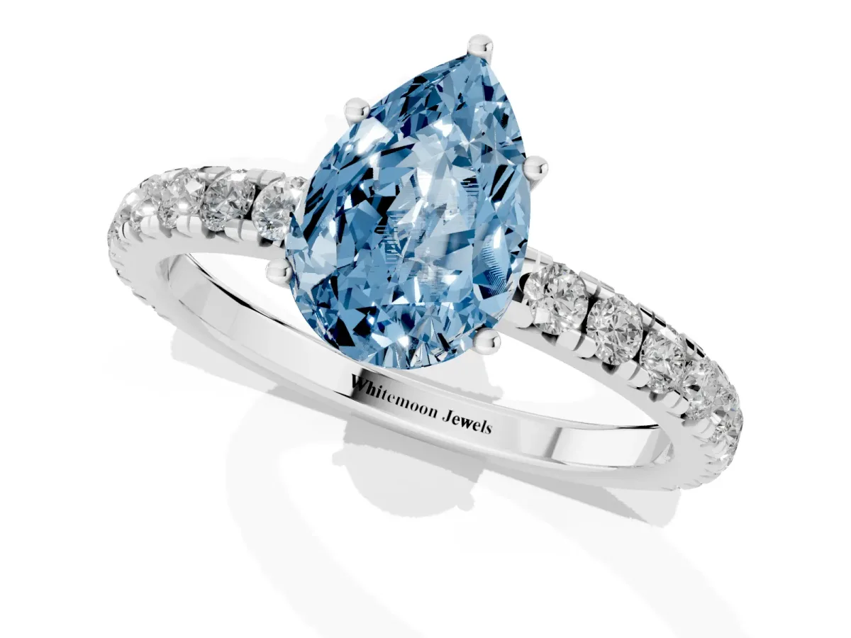 Fancy Blue Pear Cut Diamond Pavé Solitaire Engagement Ring with Four-Prong Setting Platinum
