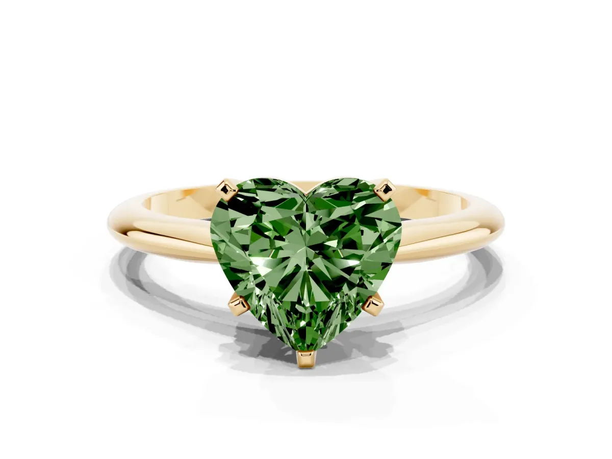 Fancy Green Heart Cut Cut Solitaire Ring with Four-Prong Setting on a Classic Band Yellow gold