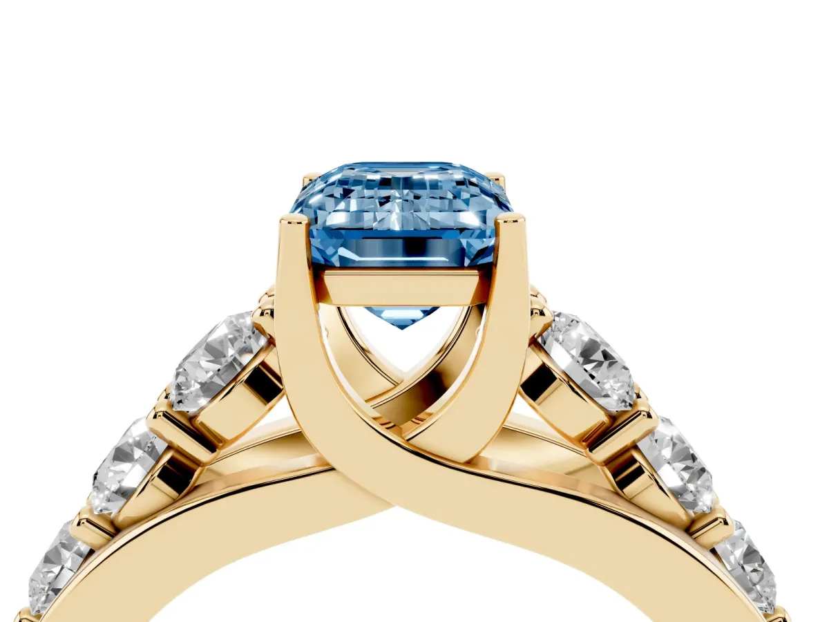 Fancy Blue Emerald Cut Diamond Engagement Ring with Pavé Band and Four-Prong Setting Yellow gold