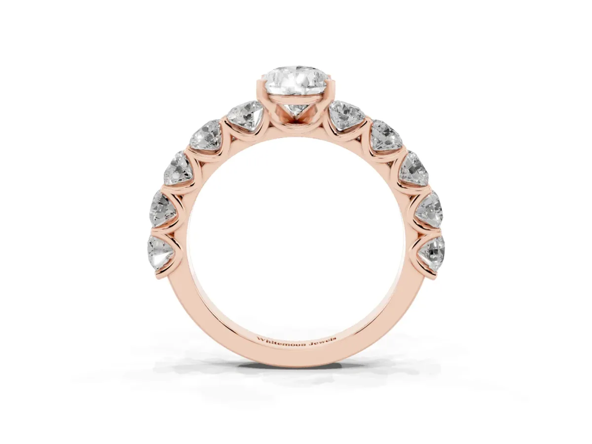 Pear Cut Diamond Prong Setting with Side Stones on a Pave Band Rose gold