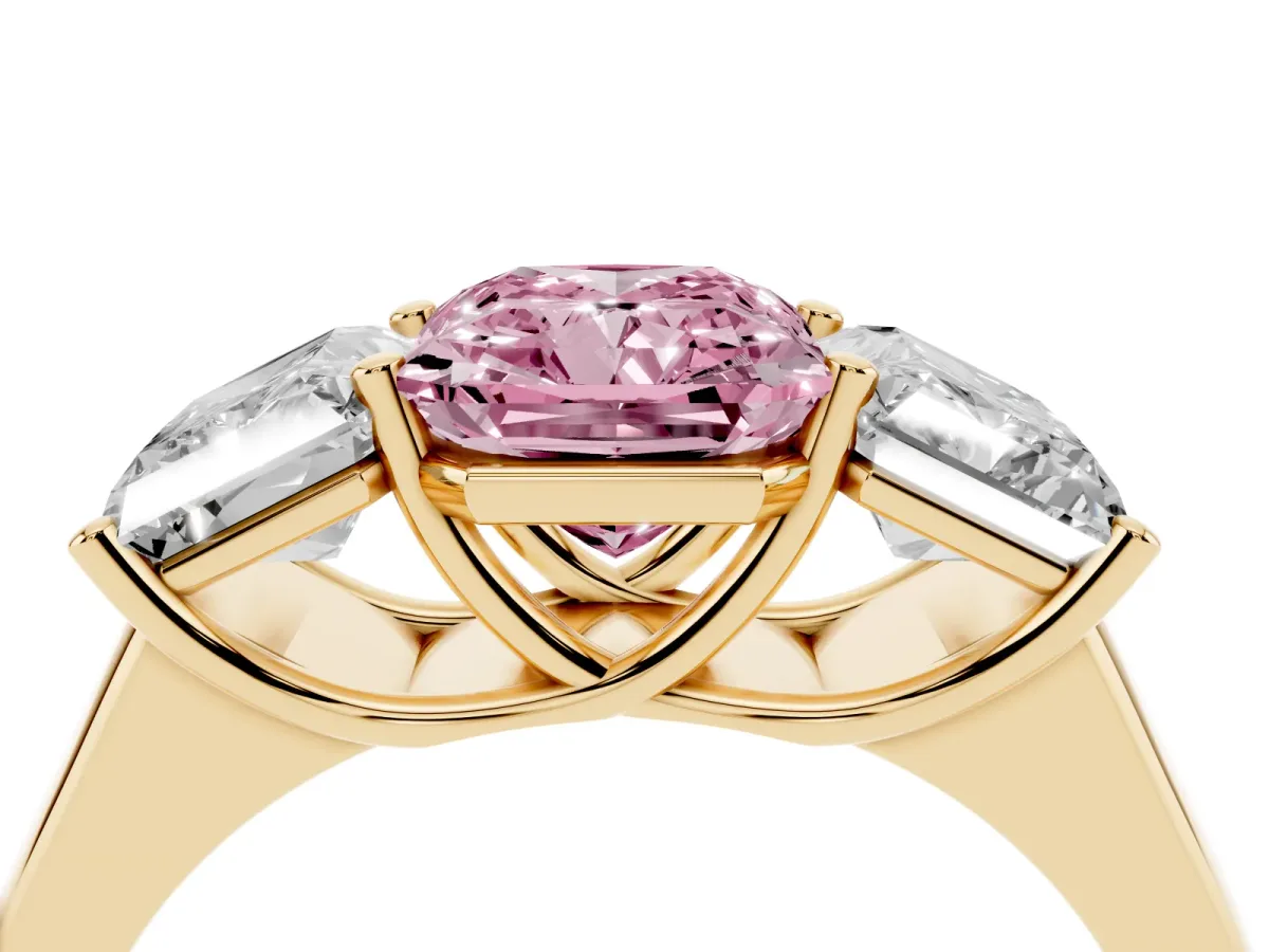 Fancy Pink Radiant Cut Three-Stone Diamond Ring with Prong Setting on a Classic Band Yellow gold