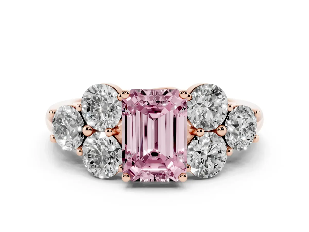 Fancy Pink Emerald Cut Cut Diamond Cluster Ring with Round Accent Stones and Prong Setting on a Classic Band Rose gold