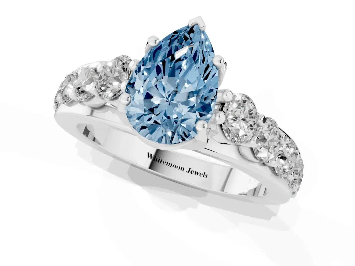 Fancy Blue Pear Cut Diamond Engagement Ring with Pavé Band and Four-Prong Setting Silver