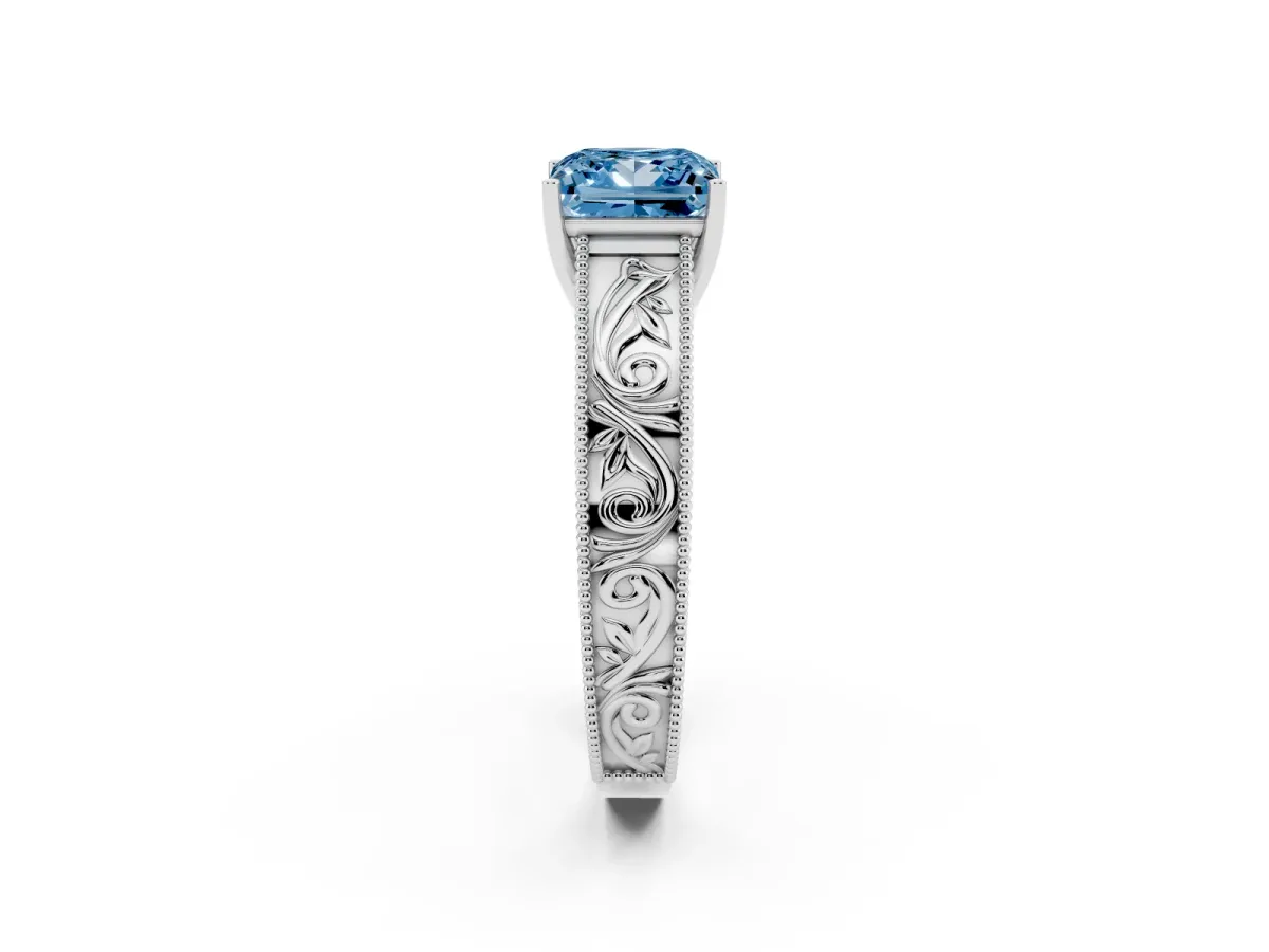 Fancy Blue Princess Cut Diamond Solitaire Ring with Engraved Band and Four-Prong Setting White gold