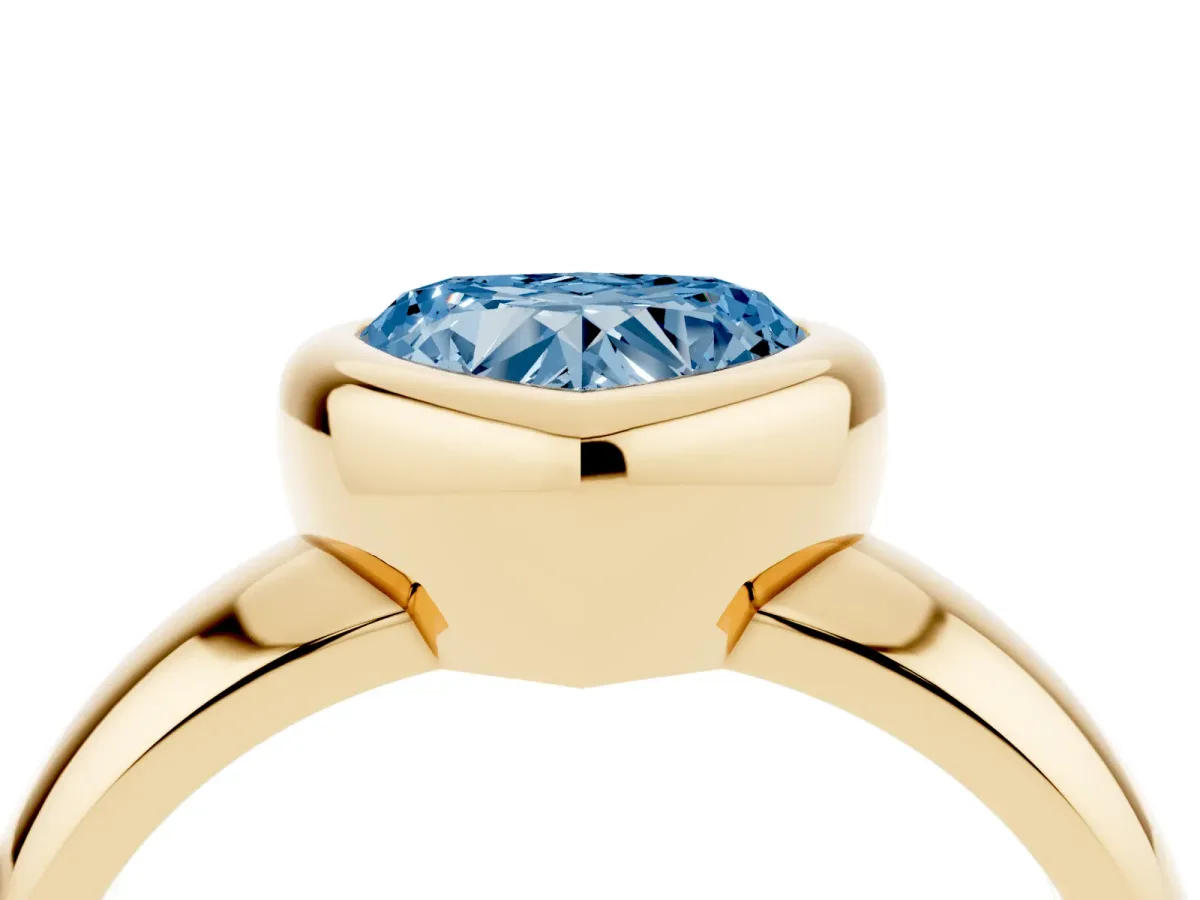 Fancy Blue Bezel Set Heart Cut Solitaire Ring with Wide Band Yellow gold