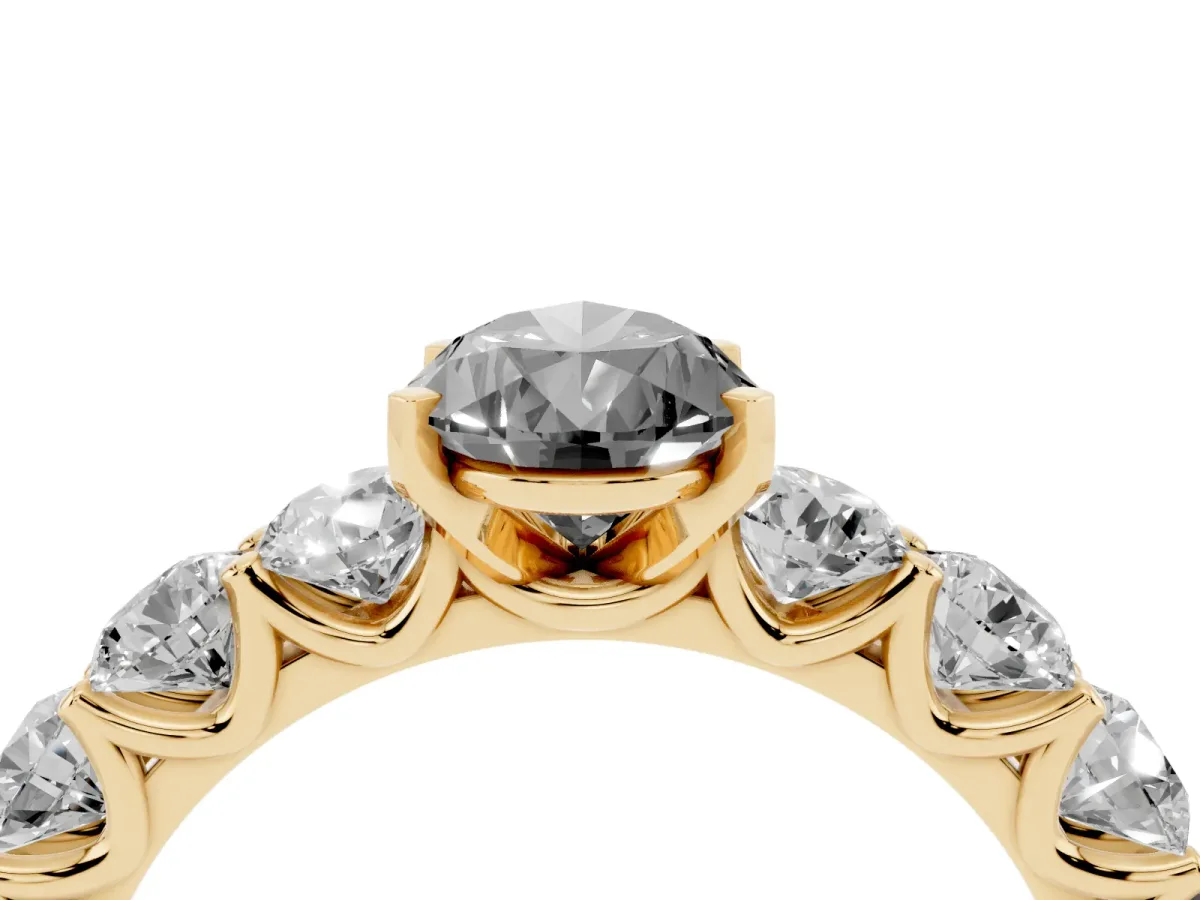 Fancy Black Pear Cut Diamond Prong Setting with Side Stones on a Pave Band Yellow gold