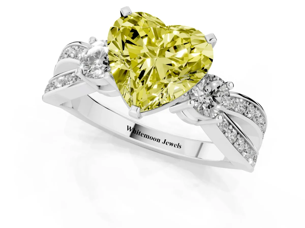 Fancy Yellow Three-Stone Heart Cut Cut Diamond Twist Band with Prong Setting Platinum