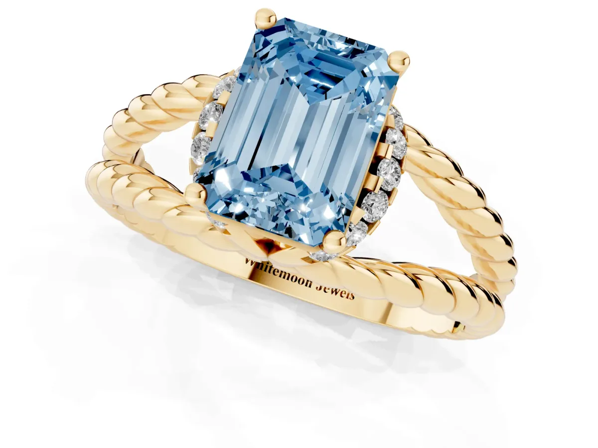 Fancy Blue Emerald Cut Halo Twisted Band Four-Prong Ring Yellow gold