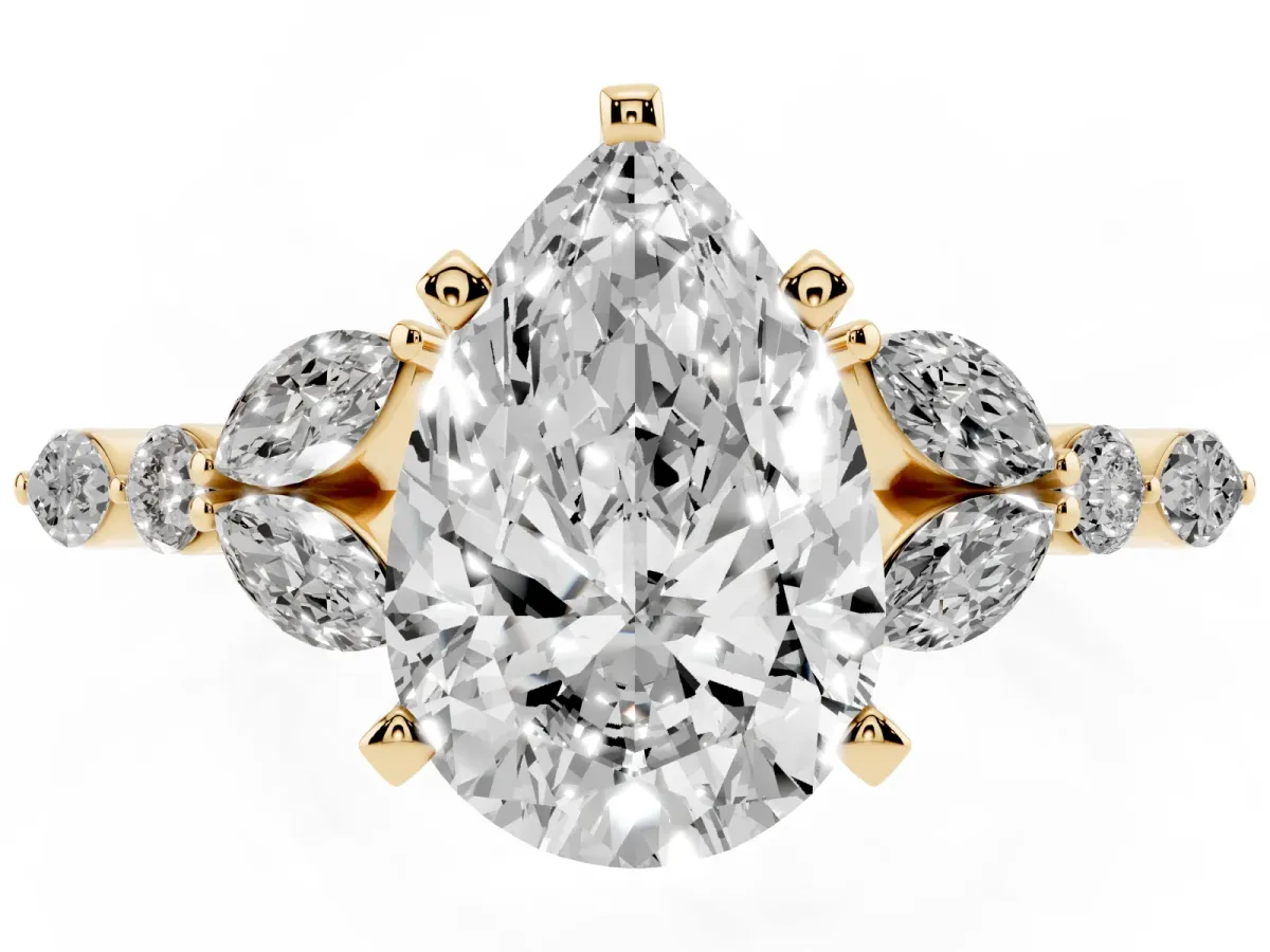 Pear Cut Diamond Solitaire Ring with Side Stones and Four-Prong Setting Yellow gold