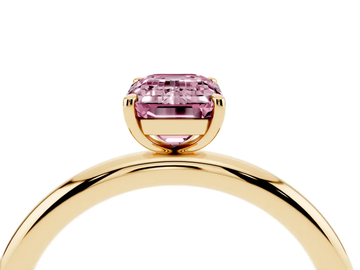 Fancy Pink Emerald Cut Solitaire Diamond Ring with Four-Prong Setting on a Plain Band Yellow gold