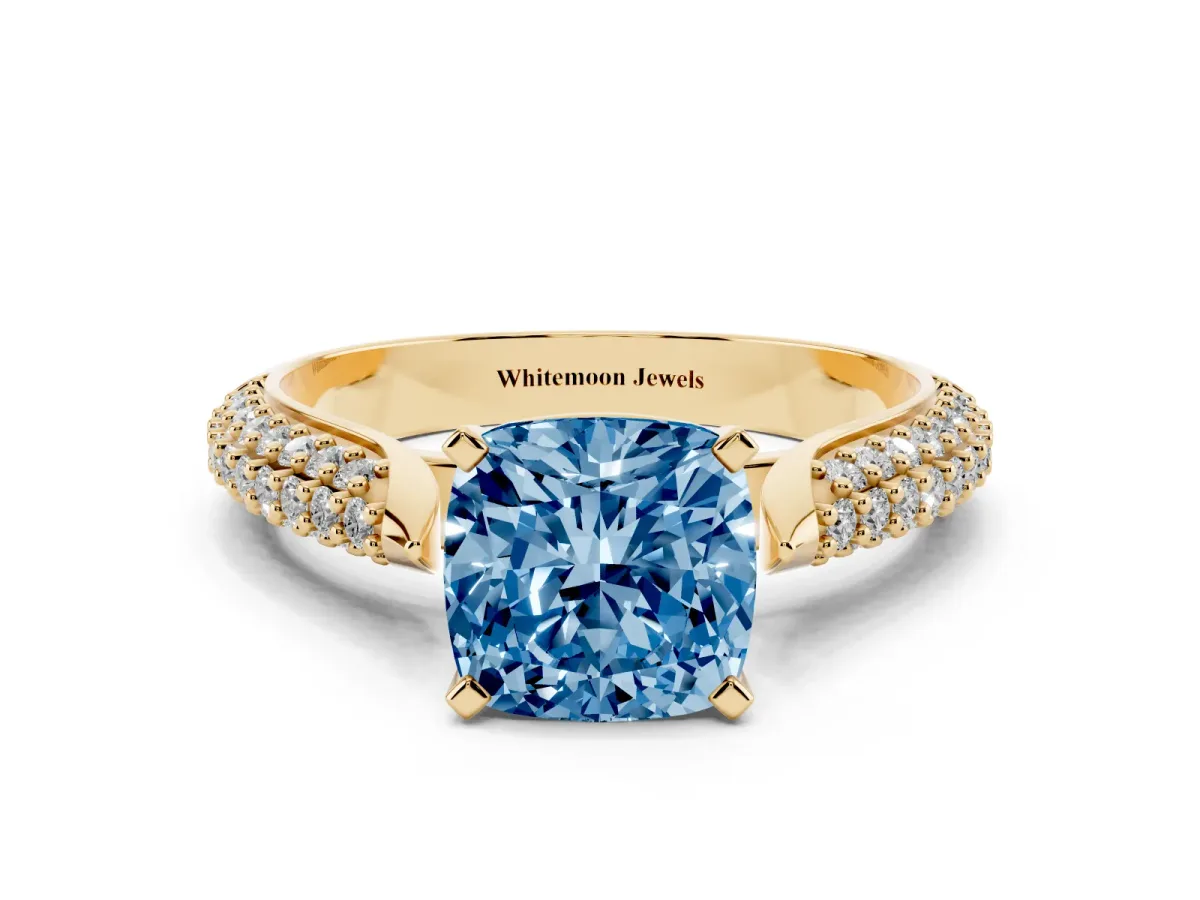 Fancy Blue Cushion Cut Diamond Solitaire Engagement Ring with Multi-Row Round Pavé Band and Prong Setting Yellow gold