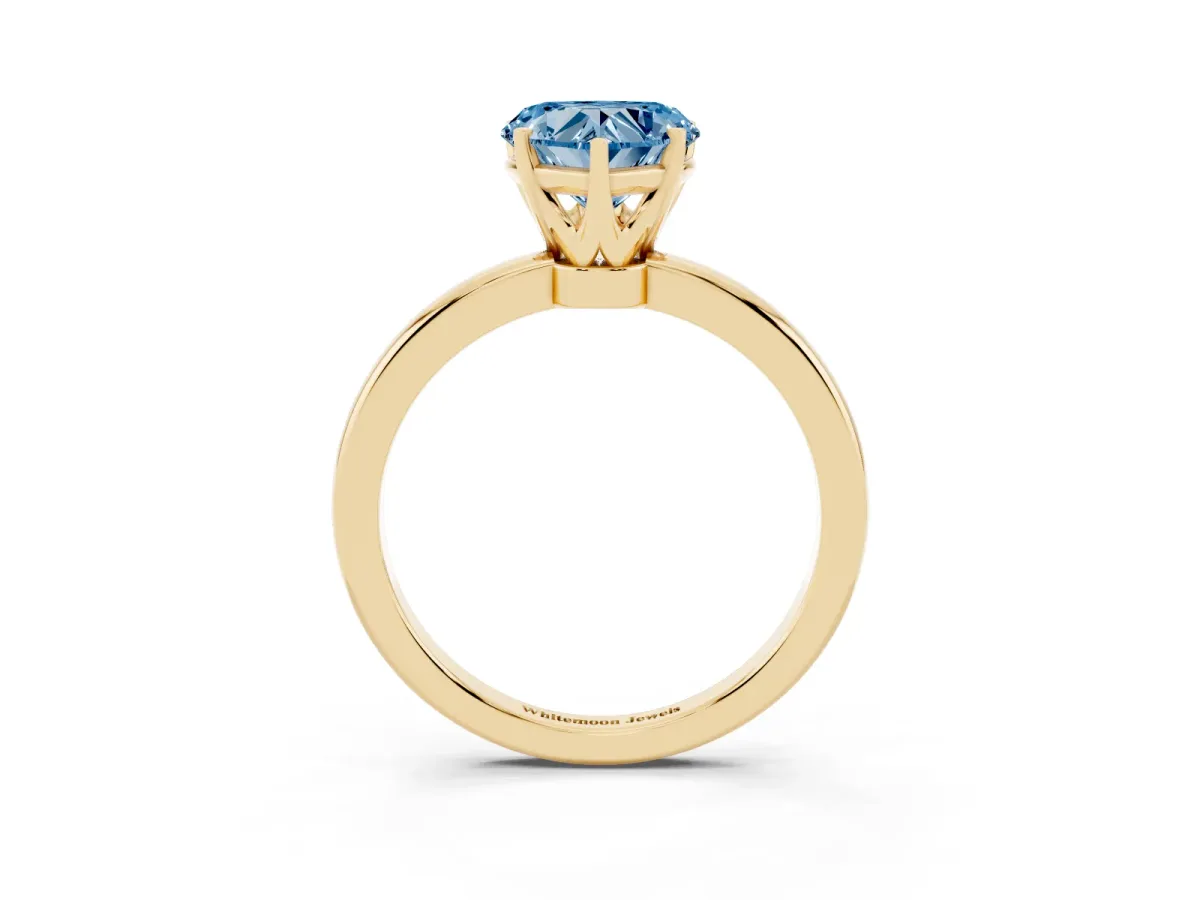 Fancy Blue Heart Cut Solitaire Diamond Ring with Six-Prong Setting on a Classic Band Yellow gold