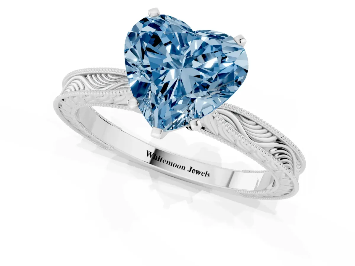 Fancy Blue Heart Cut Solitaire Milgrain Engraved Band with Four-Prong Setting Platinum