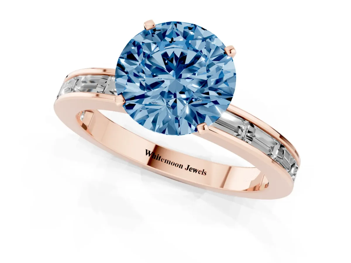 Fancy Blue Round Cut Solitaire Diamond Ring with Channel-Set Baguette Band and Four-Prong Setting Rose gold