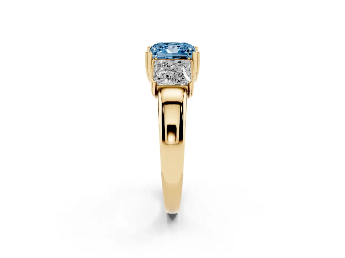 Fancy Blue Three-Stone Princess Cut Cut Diamond Ring with Channel Set Band and Four-Prong Setting Yellow gold