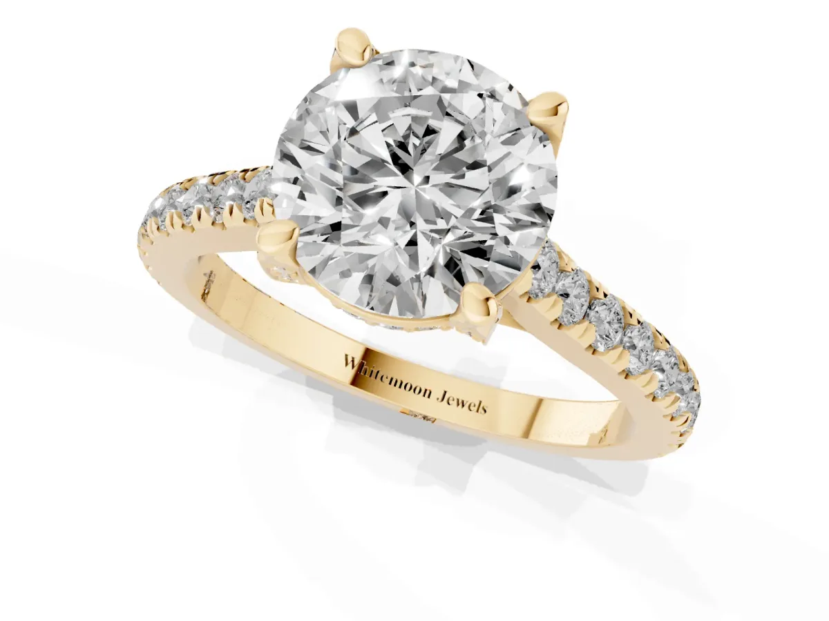 Round Cut Brilliant Diamond Solitaire with Pavé Band and Four-Prong Setting Yellow gold