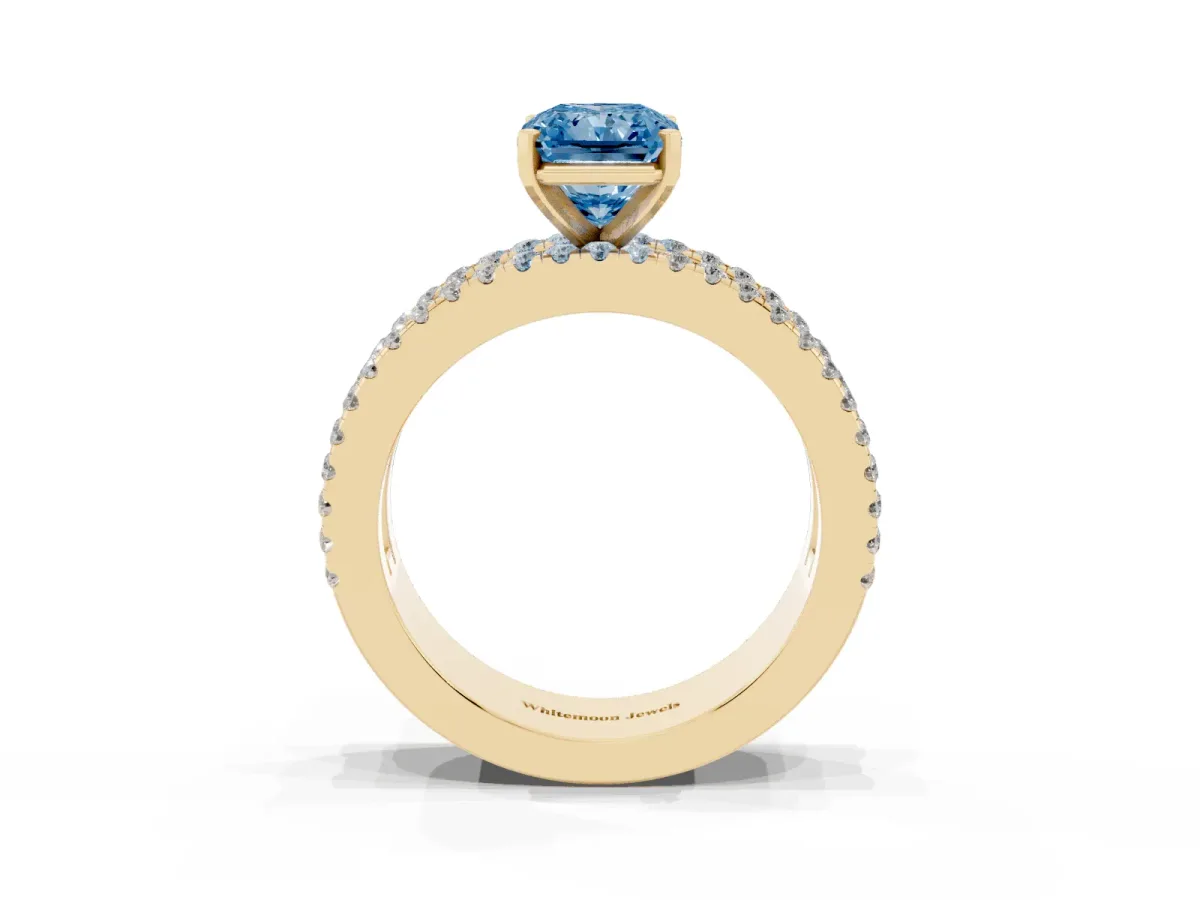 Fancy Blue Radiant Cut Diamond Solitaire Ring with Pavé and Channel Set Band Yellow gold