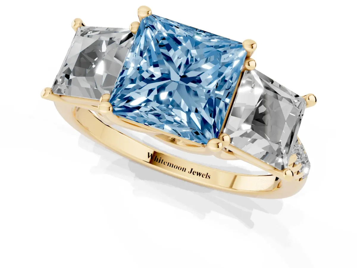 Fancy Blue Three-Stone Princess Cut Diamond Ring with Round Pavé Band and Prong Setting Yellow gold