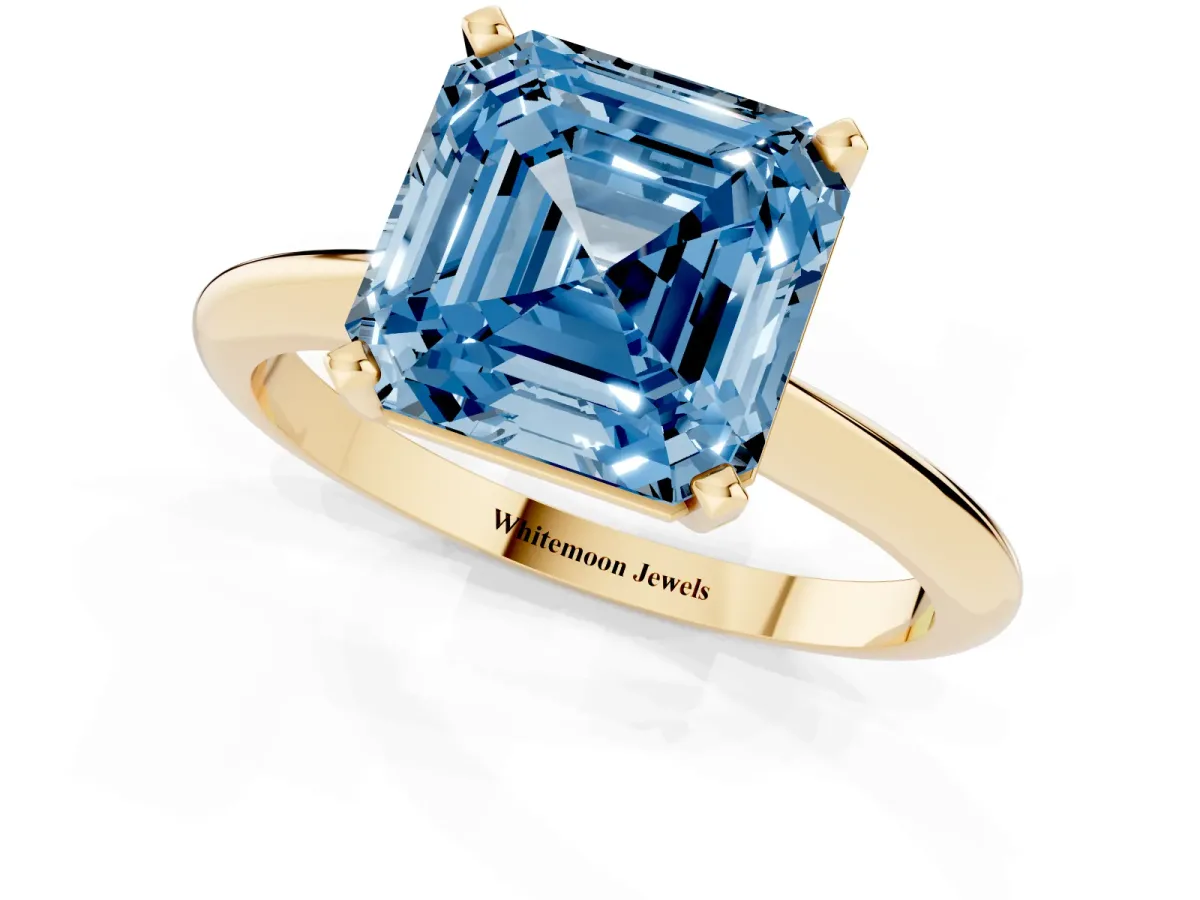 Fancy Blue Asscher Cut Cut Solitaire Ring with Four-Prong Setting on a Classic Band Yellow gold