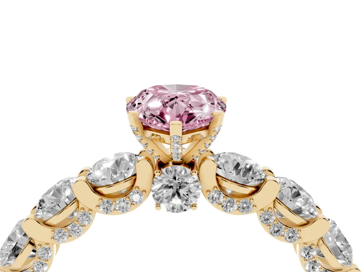Fancy Pink Pear Cut Diamond Side Stone Engagement Ring with Four-Prong Setting Yellow gold